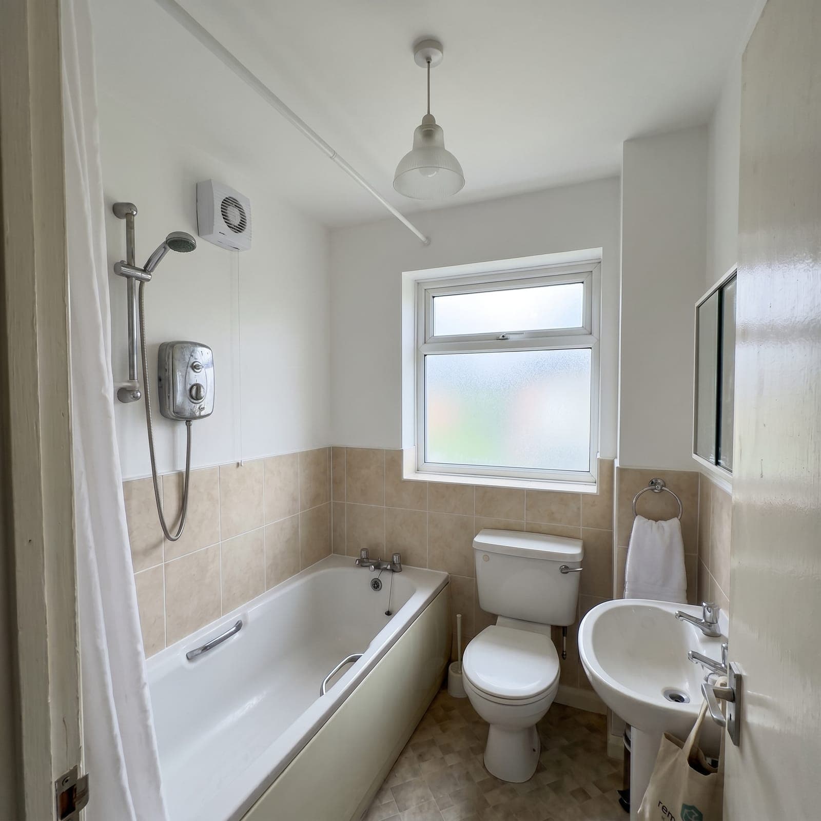 After: Croydon house - severe bathroom mould, failed extractor replaced at root cause, biocide treatment, anti-mould grout and paint, 24-hour turnaround, 12-month warranty