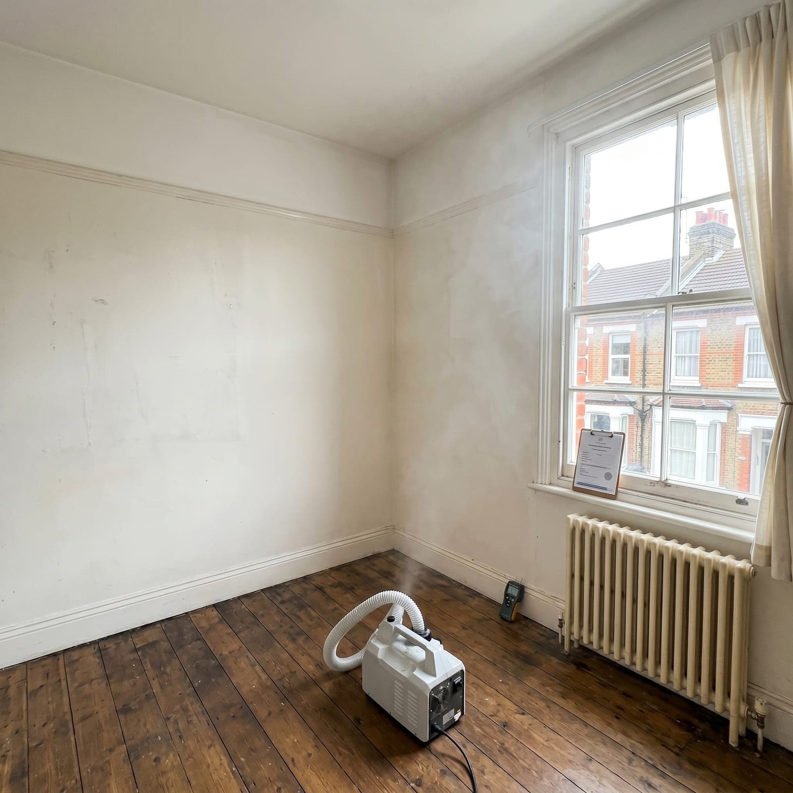 After: Hackney Victorian terrace - black mould treated with biocide fogging, moisture source resolved, walls professionally refinished, 12-month warranty